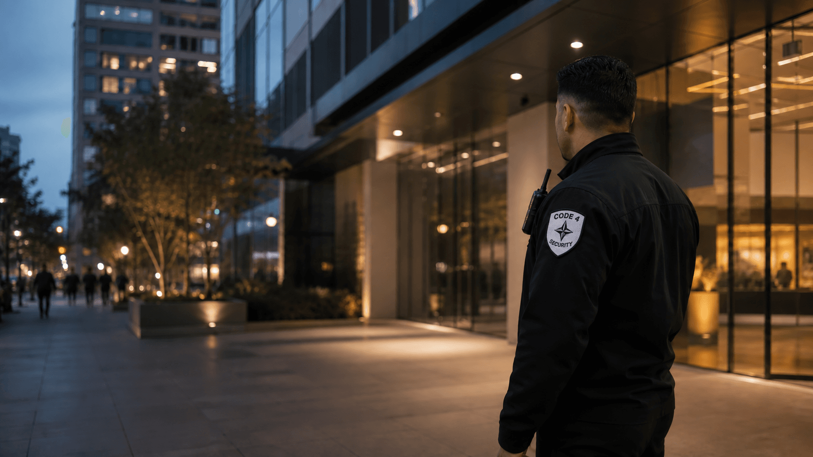 Fictional Code 4 security professional wearing a branded shoulder patch outside a Los Angeles commercial property