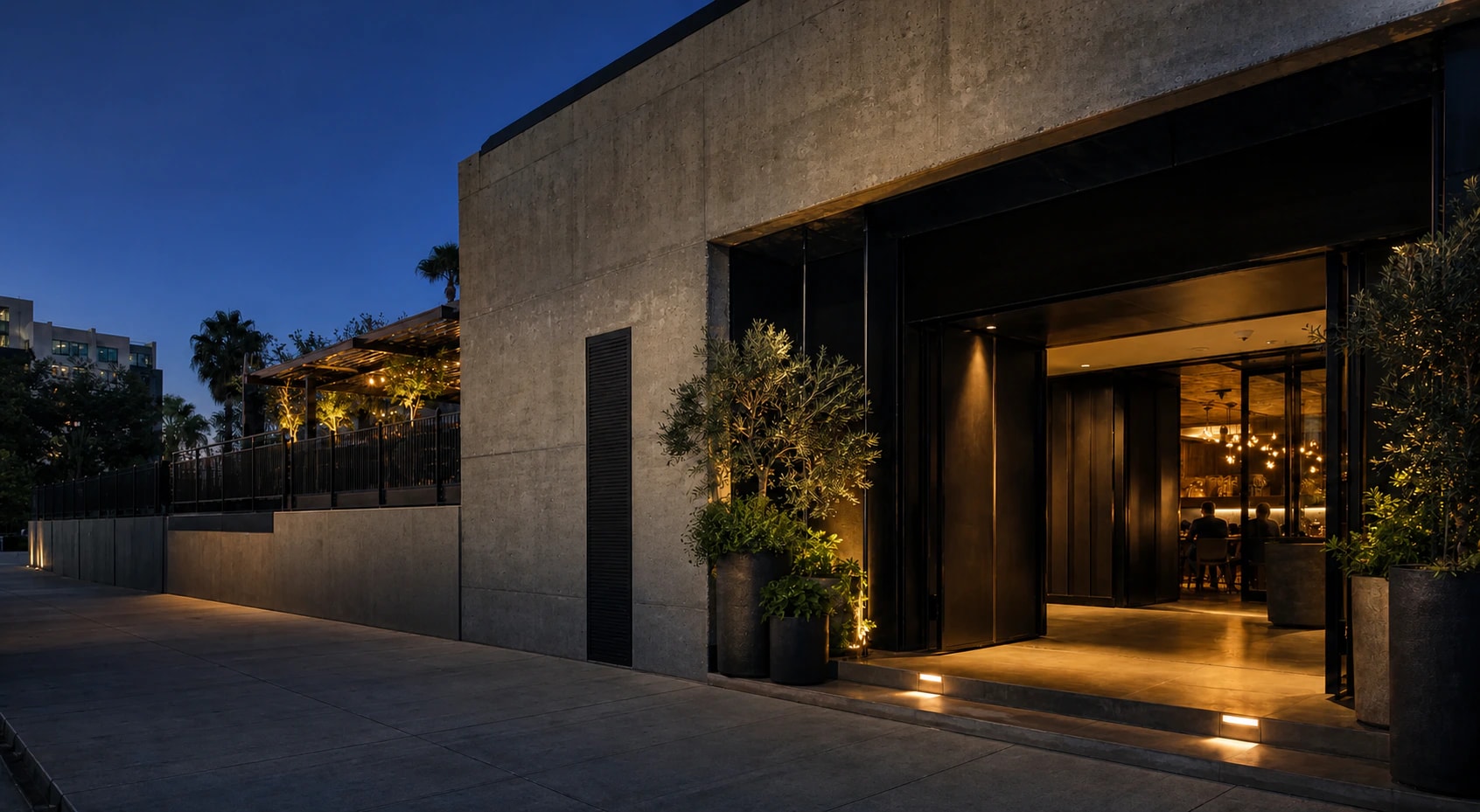 Fictional hospitality venue entrance at blue hour